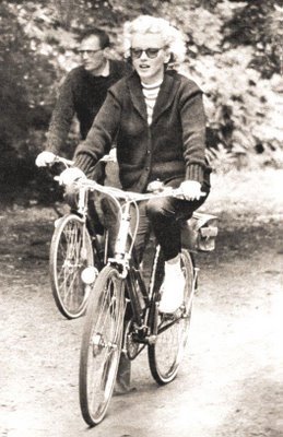 Marilyn Monroe and Arthur Miller ride bikes.jpg